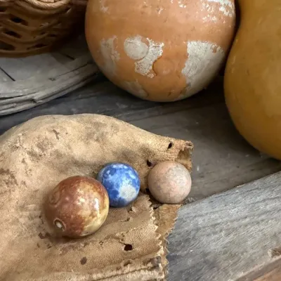 Sale Photo Thumbnail #165: Antique clay marbles on leather pouch