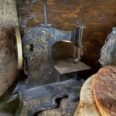 Sale Photo Thumbnail #255: Antique gold-stenciled cast iron toy sewing machine