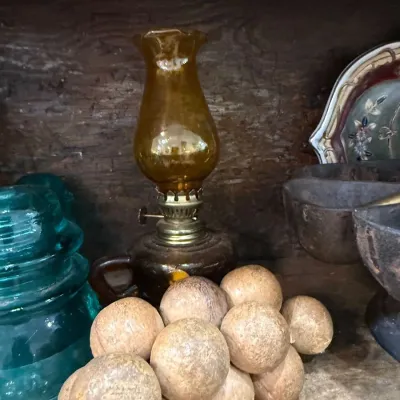 Sale Photo Thumbnail #266: Amber glass finger oil lamp with wooden balls