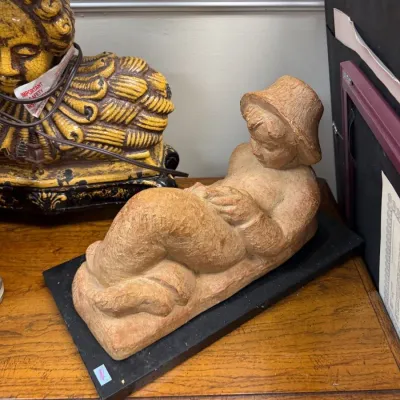 Sale Photo Thumbnail #352: Carved stone reclining figure sculpture