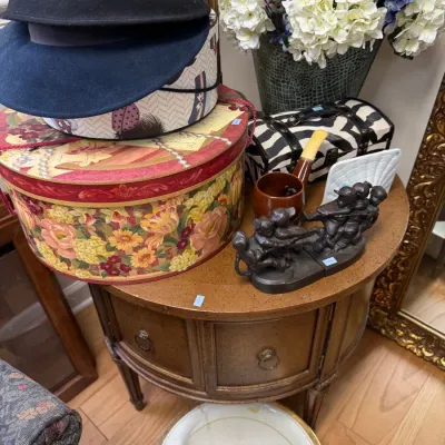 Sale Photo Thumbnail #378: Demilune console table with vintage hats and hat boxes