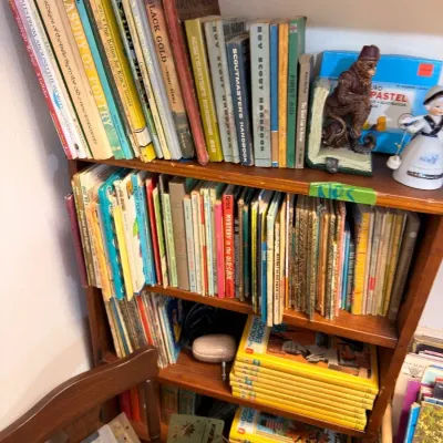Sale Photo Thumbnail #448: Shelves of vintage children's books and Boy Scout handbooks