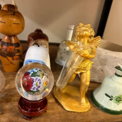 Sale Photo Thumbnail #528: Kokeshi doll, glass paperweight and gold cherub
