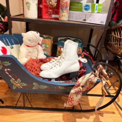 Sale Photo Thumbnail #555: Painted holly sleigh with vintage white ice skates