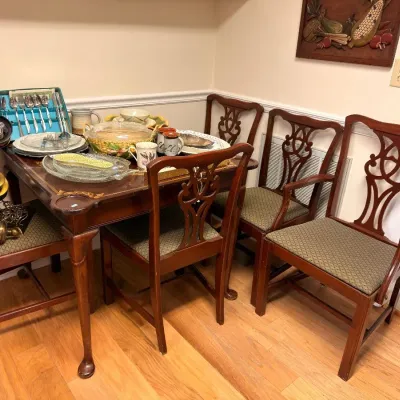 Sale Photo Thumbnail #581: Mahogany dining table with Chippendale-style chairs