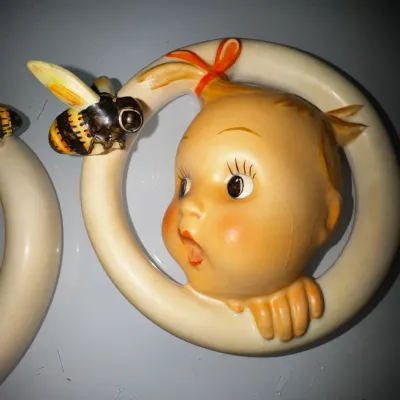 Pair of vintage Goebel M.I. Hummel "Ba-Bee Ring" girl & boy porcelain wall plaques