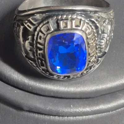 Sale Photo Thumbnail #27: Jostens Argentus  ~  1982 Cairo Durham, SC high school RING 
> sterling with palladium alloy 
> size :  11
excellent condition..............has original owner name inscribed inside