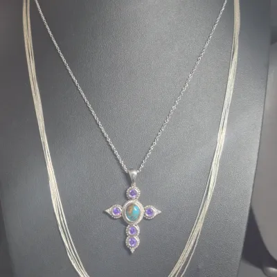 Sale Photo Thumbnail #90: Set 2 Necklaces & hoop Earrings
< glass inset Cross necklace is 16" choker 
> 5 strand thin necklace is 18" w/with cluster clasp
> small silver hoop earrings with pierced clasps