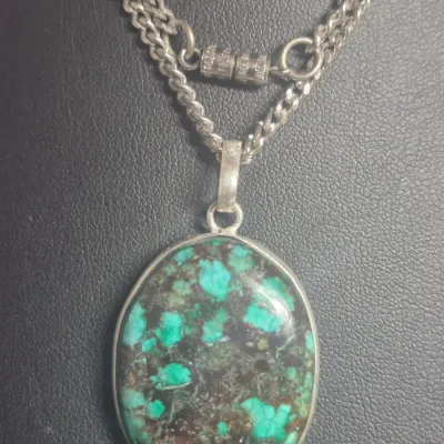 Sale Photo Thumbnail #114: Tibetan Turquoise Sterling Silver Pendant: Oval Gemstone & Earrings match
> necklace is oval set in open bezel, marked 925 in bail
> necklace is 20" length.....has screw clasp
> Earring are a dagle and close match for set...pin posts