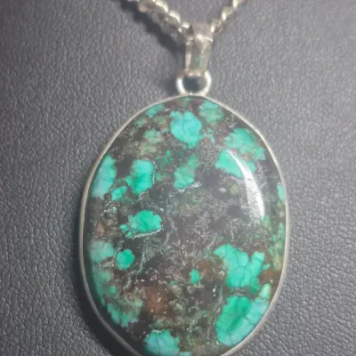 Sale Photo Thumbnail #112: Tibetan Turquoise Sterling Silver Pendant: Oval Gemstone & Earrings match
> necklace is oval set in open bezel, marked 925 in bail
> necklace is 20" length.....has screw clasp
> Earring are a dagle and close match for set...pin posts