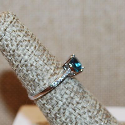 Size 6¾ Transparent Blue Stone Asscher Cut 4 Prong with Side Accents on a Silver Tone Band (1.4g)