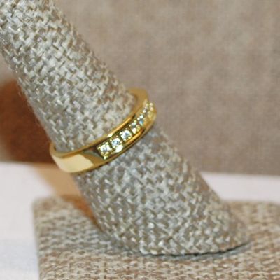 Size 8 Half Infinity Style Ring with Center Row of Clear Stones on a Gold Tone Band (3.6g)