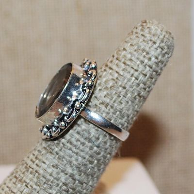 Size 9 SMOKEY TOPAZ OVAL Shape Transparent Glass Rhinestone Ring with a FULL Loop Rim Setting on a Silver Tone Band (5.1g)