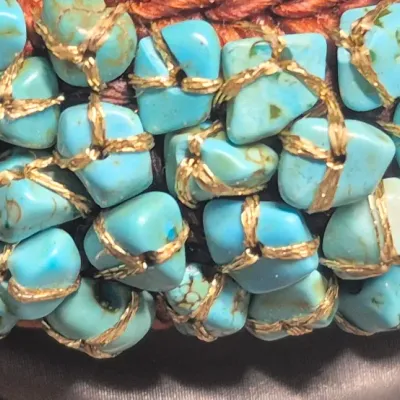 Sale Photo Thumbnail #115: Woven Bracelet Turquoise Colored Stones expandable Cuff, Brown colored with turquoise colored stones, Untested.
All stones are individually wrapped and tied.
Boho or native American style.......excellent condition