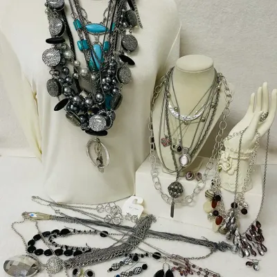 Sale Photo Thumbnail #137: Statement fashion jewelry assortment with a bold mix of layered necklaces, earrings and coordinating sets featuring turquoise-tone accents, smoky and metallic beads, faceted crystals, rhinestones, black cabochons, cat-eye style stones, chunky chains, pend