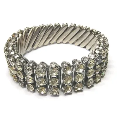 Sale Photo Thumbnail #179: Three Row Rhinestone Stretch Bracelet Vintage Silver Tone British Hong Kong ~1950-60s
Measurements from 6" up to 8.5"
Marked British Hong Kong
Good vintage condition