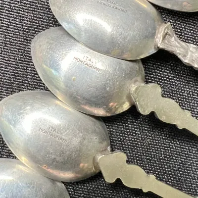 Sale Photo Thumbnail #230: Mid to late 20th century vintage / antique/ silver / silverplated / pewter souvenir spoons. 
marked ITALY Montagnani on spoon bowls
pewter, all great condition, no bends or breaks.
polished to tone