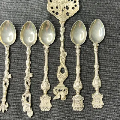 Sale Photo Thumbnail #229: Mid to late 20th century vintage / antique/ silver / silverplated / pewter souvenir spoons. 
marked ITALY Montagnani on spoon bowls
pewter, all great condition, no bends or breaks.
polished to tone