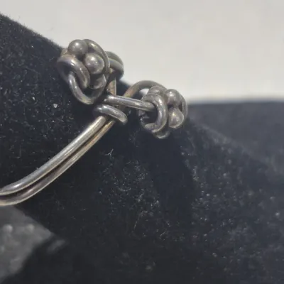 Sale Photo Thumbnail #319: Vintage Ring tested 925 STERLING SILVER Size 4 Wire Band 
excellent condition, cleaned and toned to luster.
WGT: 1.36g //////size 4 adjustable