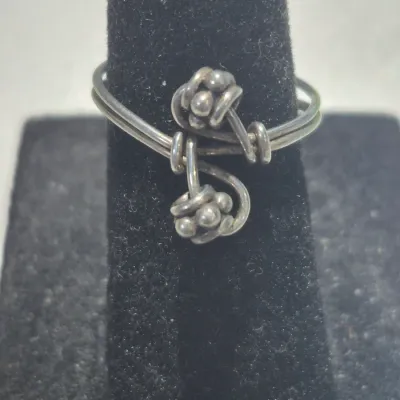Sale Photo Thumbnail #317: Vintage Ring tested 925 STERLING SILVER Size 4 Wire Band 
excellent condition, cleaned and toned to luster.
WGT: 1.36g //////size 4 adjustable