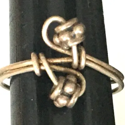 Sale Photo Thumbnail #322: Vintage Ring tested 925 STERLING SILVER Size 4 Wire Band 
excellent condition, cleaned and toned to luster.
WGT: 1.36g //////size 4 adjustable