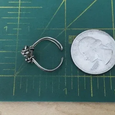 Sale Photo Thumbnail #321: Vintage Ring tested 925 STERLING SILVER Size 4 Wire Band 
excellent condition, cleaned and toned to luster.
WGT: 1.36g //////size 4 adjustable