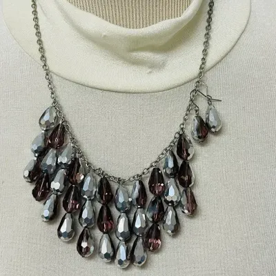 Sale Photo Thumbnail #367: Statement fashion jewelry assortment with a bold mix of layered necklaces, earrings and coordinating sets featuring turquoise-tone accents, smoky and metallic beads, faceted crystals, rhinestones, black cabochons, cat-eye style stones, chunky chains, pend