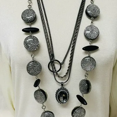 Sale Photo Thumbnail #365: Statement fashion jewelry assortment with a bold mix of layered necklaces, earrings and coordinating sets featuring turquoise-tone accents, smoky and metallic beads, faceted crystals, rhinestones, black cabochons, cat-eye style stones, chunky chains, pend