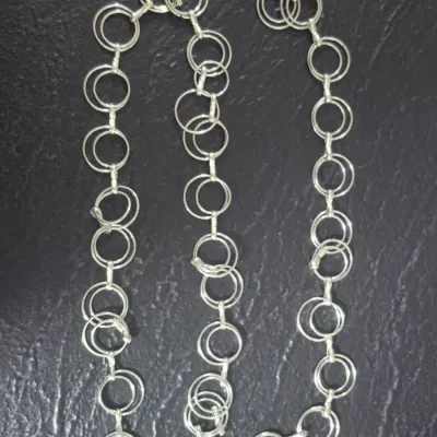Sale Photo Thumbnail #370: Vintage FASHIONABLE Chain Belt ~ AL Rings 
Now the hot fashion on runways and ads.
all Aluminum circles chain with easy lobster claw clasp
size:  42"
