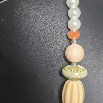 Sale Photo Thumbnail #401: Vintage Bulky Necklace with carved stones +beads & Bracelet + Earrings  [3 PCs]
> Necklace is stunning with earth tones and carved stones.....18", lobster claw closure
> Bracelet matches 
> Earrings are amber glass pierced