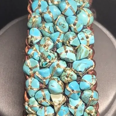 Sale Photo Thumbnail #403: Woven Bracelet Turquoise Colored Stones expandable Cuff, Brown colored with turquoise colored stones, Untested.
All stones are individually wrapped and tied.
Boho or native American style.......excellent condition