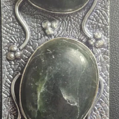 Sale Photo Thumbnail #426: Vasonite Gemstone Handmade 925 Sterling Silver Jewelry Pendant 2.92" 
on solid collar choker ......unbranded
The image shows a rectangular, textured silver pendant featuring dark green marbled stones—resembling a Kambaba or star galaxy jasper gemstone s