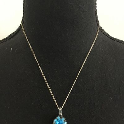 Glass pendant and silver tone chain