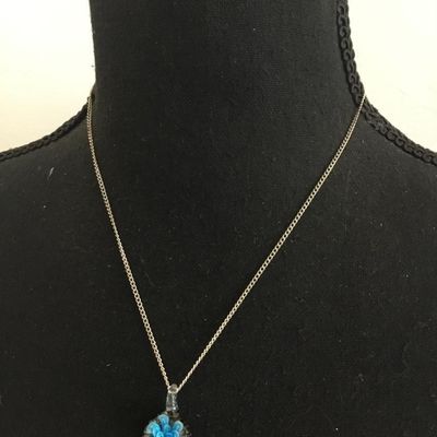 Glass pendant and silver tone chain