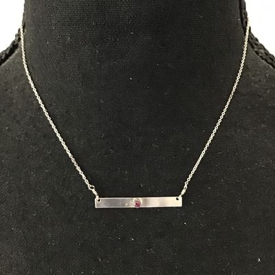 Minimalist silver bar necklace, featuring a small Denzel set red garnet or ruby gemstone on a delicate chain