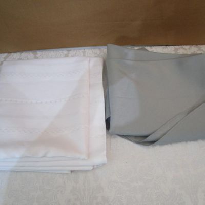 Sale Photo Thumbnail #31: Like new white tablecloth is rectangular 101" x 60", gray tablecloth is round 96" in diameter, see pictures