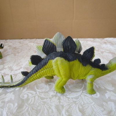 Sale Photo Thumbnail #581: 2 Stegosaurus 1-12" long, 1- 9.5" long; 1 ankylosaurus 6" long; 1 duck-billed Trachodon 5.5" long; See pictures
