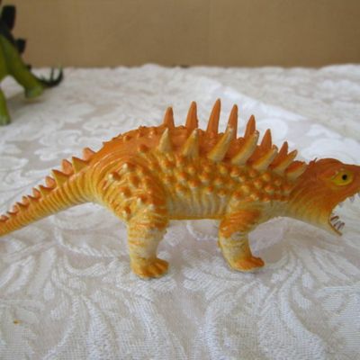 Sale Photo Thumbnail #577: 2 Stegosaurus 1-12" long, 1- 9.5" long; 1 ankylosaurus 6" long; 1 duck-billed Trachodon 5.5" long; See pictures