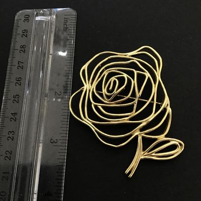 Gold tone rose brooch