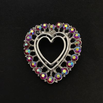 Silver tone heart shaped brooch