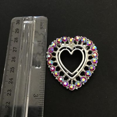 Silver tone heart shaped brooch