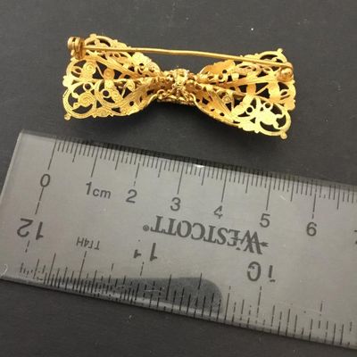 Beautiful, vintage, gold tone, filigree bow brooch