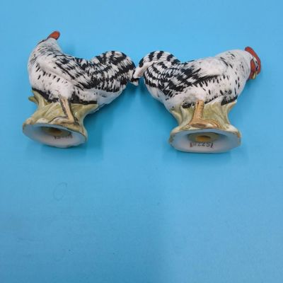Porcelain figural lot — two children, bird on nest and pair of chickens (approx. 5 pcs)