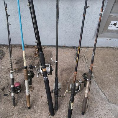 Lot of ~8 Used Fishing Rods with Reels — includes Ugly Stik (visible), mixed grips