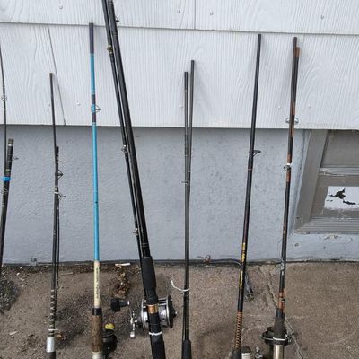 Lot of ~8 Used Fishing Rods with Reels — includes Ugly Stik (visible), mixed grips
