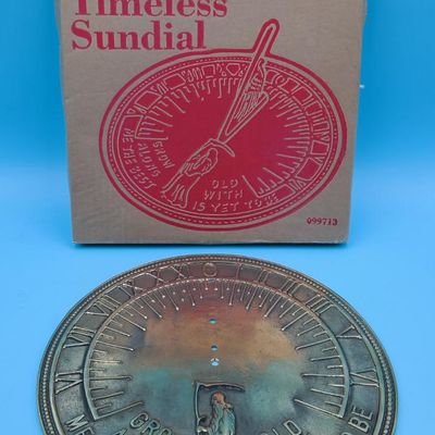 Brookstone "Timeless Sundial" brass‑tone sundial face with original box (gnomon not visible)