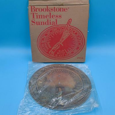 Brookstone "Timeless Sundial" brass‑tone sundial face with original box (gnomon not visible)