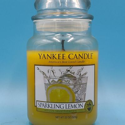 Lot of approximately 11 Yankee Candle glass jar candles — assorted scents & sizes