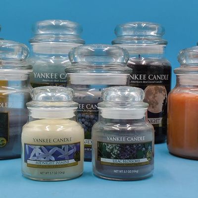 Lot of approximately 11 Yankee Candle glass jar candles — assorted scents & sizes