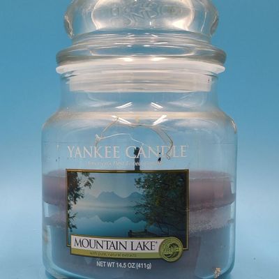 Lot of approximately 11 Yankee Candle glass jar candles — assorted scents & sizes